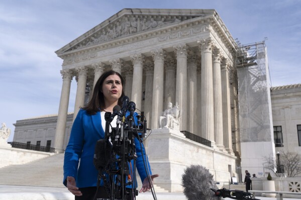 Colorado Secretary of State Jena Griswold speaks in front of the U.S. Supreme Court, Thursday, Feb. 8, 2024, in Washington. (AP Photo/Manuel Balce Ceneta)