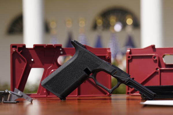 FILE - A 9mm "ghost gun" pistol build kit with a commercial slide and barrel with a polymer frame is displayed in the Rose Garden of the White House, April 11, 2022, in Washington. (AP Photo/Carolyn Kaster, File)