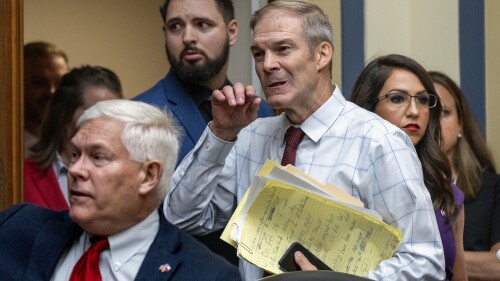 House Judiciary Committee Chair Jim Jordan, R-Ohio, center, flanked by Rep. Pete Sessions, R-Texas, left, and Rep. Lauren Boebert, R-Colo., arrives as the House Oversight and Accountability Committee holds a hearing to charge that the Justice Department interfered with a yearslong investigation into Hunter Biden, at the Capitol in Washington, Wednesday, July 19, 2023. (AP Photo/J. Scott Applewhite)