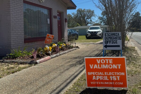 A sign for Democrat Gay Valimont is displayed outside the Escambia County Democratic Party office in Pensacola, Fla. on March 18, 2025. (AP Photo/Kate Payne)