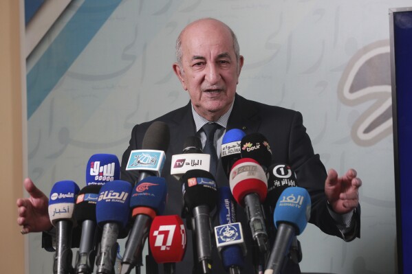 FILE - Algeria's President Abdelmajid Tebboune gives a press conference, in Algiers, Algeria, Sunday, 24, 2019. Algeria's presidential campaign is officially starting a week ago with five candidates vying to replace the longtime leader pushed out in April in an ongoing protest movement. Algeria has scheduled this year’s presidential elections for September 7, providing more than five months for first-term President Abdelmajid Tebboune to campaign for a second term to lead the oil-rich north African nation, his office said in a statement on Thursday, March 21, 2024. (AP Photo/Fateh Guidoum, File)