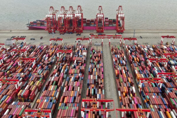 FILE - The Yangshan container port is seen in an aerial view in Shanghai, China on July 10, 2021. China’s exports tumbled in June, 2023, by 12.4% compared with a year earlier amid weaker global demand and higher inflation. (Chinatopix via AP, File)