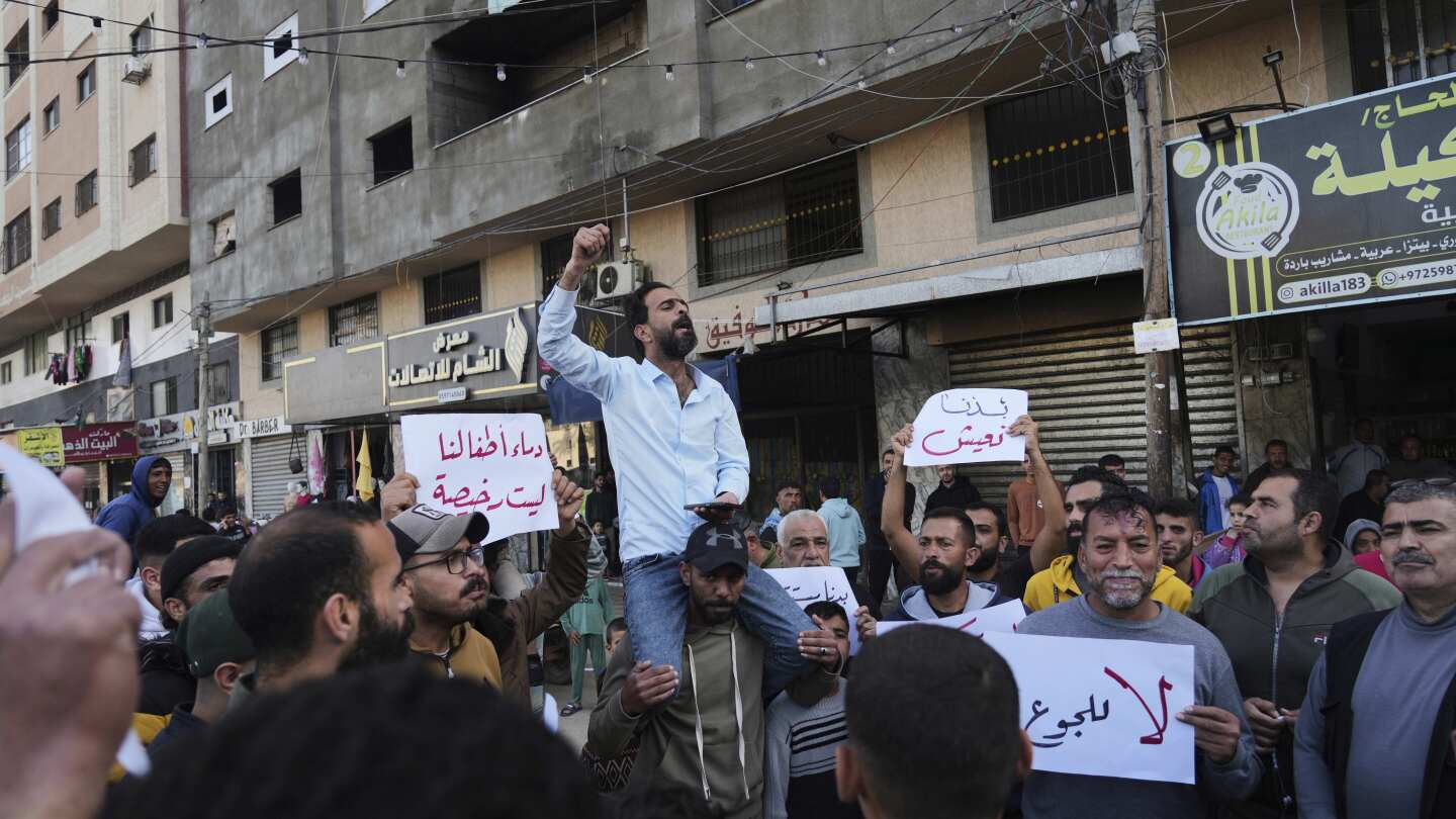 Middle East latest: Israel orders more evacuations and Palestinians stage rare anti-Hamas protests