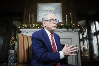 FILE- In this Dec. 13, 2019 file photo, Ohio Gov. Mike DeWine speaks about his plans for the coming year during an interview at the Governor's Residence in Columbus, Ohio. DeWine will give a statewide address Wednesday, Nov. 11, 2020, making it the second time he will make a public appeal about the severity of the coronavirus' spread since the pandemic began in March. (AP Photo/John Minchillo, File)