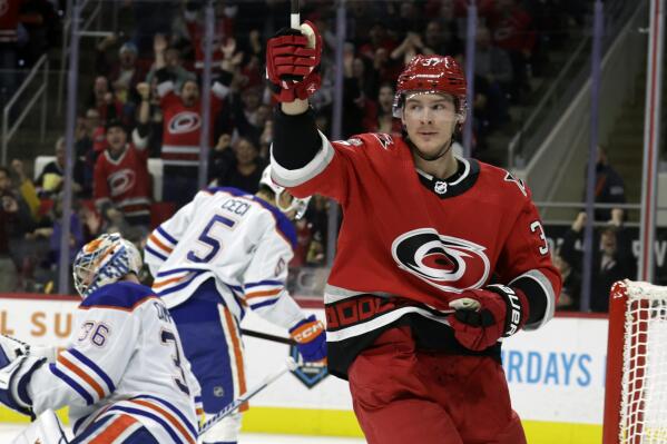 Carolina Hurricanes right wing Andrei Svechnikov (37) celebrates after he scored against Edmonton Oilers goaltender Jack Campbell (36) and defenseman Cody Ceci (5) during the second period of an NHL hockey game Thursday, Nov. 10, 2022, in Raleigh, N.C. (AP Photo/Chris Seward)