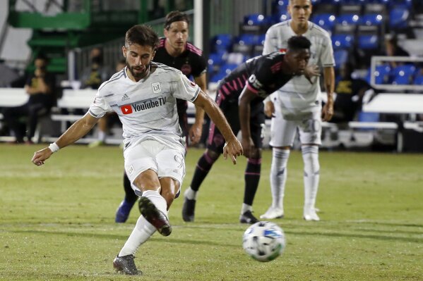 FILE - Los Angeles FC forward Diego Rossi (9) scores on a penalty kick against the Seattle Sounders during the first half of an MLS soccer match in Kissimmee, Fla., in this Monday, July 27, 2020, file photo. Nobody was better at finding the back of the net than Diego Rossi of Los Angeles FC a season ago.  (AP Photo/Reinhold Matay, File)
