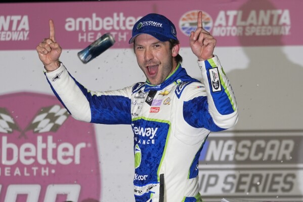 Daniel Suarez reacts after winning the NASCAR auto race at Atlanta Motor Speedway Sunday, Feb. 25, 2024, in Hampton, Ga. (AP Photo/John Bazemore)