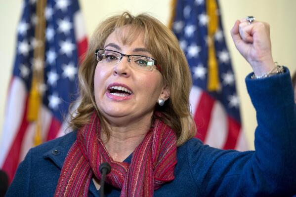FILE - Former U.S. Rep. Gabby Giffords, D-Ariz., speaks on Capitol Hill in Washington, about bipartisan legislation on gun safety on March 4, 2015. Giffords, who was forced to give up her promising political career when she was disabled in a 2011 assassination attempt, announced Saturday, Feb. 19, 2022, she was leaving a hospital after being treated for appendicitis.(AP Photo/Carolyn Kaster, File)