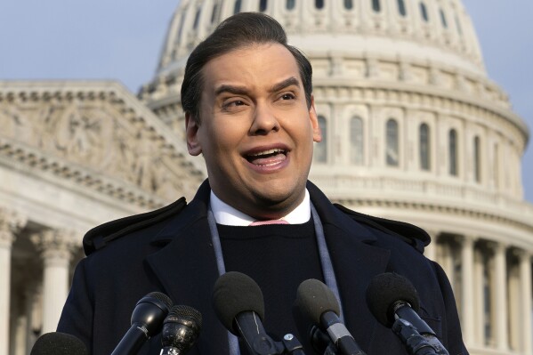 FILE - Rep. George Santos, R-N.Y., faces reporters at the Capitol, Nov. 30, 2023, in Washington. Santos said Friday, March 22, 2024, that he will leave the Republican Party and run as an independent in a bid to return to Congress after having been expelled while facing fraud charges. (AP Photo/J. Scott Applewhite, File)