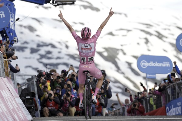 Pogačar Tadej of Team UAE Emirates celebrates after winning the 15th stage of the Giro d'Italia from Manerba del Garda to Livigno, Italy, Sunday, May 19, 2024. (Marco Alpozzi /LaPresse via AP)
