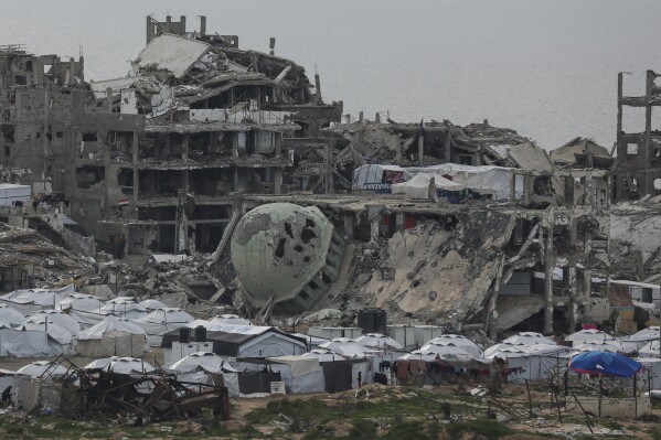 A tent camp for the Palestinians is installed in the middle of the buildings destroyed in the west of the Al-Shati camp, west of Gaza City, Monday March 3, 2025. (AP photo / Jehad Alshrafi)