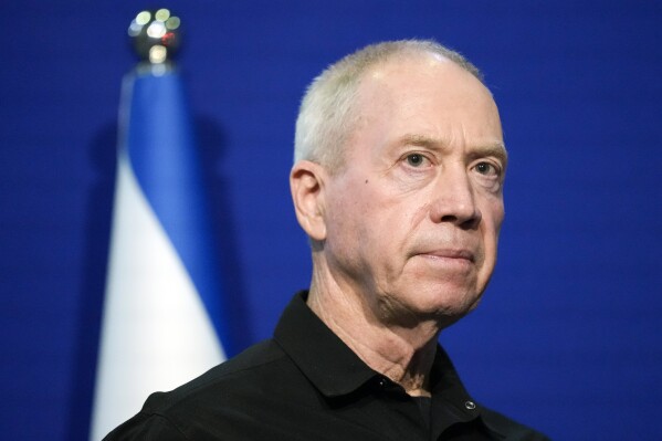 Israeli Defense Minister Yoav Gallant pauses while making a brief statement to the media with U.S. Secretary of State Antony Blinken, not pictured, at The Kirya, Israel's Ministry of Defense, Monday, Oct. 16, 2023, in Tel Aviv. The chief prosecutor of the International Criminal Court said Monday, May 20, 2024, he is seeking arrest warrants for Israeli and Hamas leaders, including Israeli Prime Minister Benjamin Netanyahu, in connection with their actions during the seven-month war between Israel and Hamas. Netanyahu, his defense minister Gallant, and three Hamas leaders, are believed to be responsible for war crimes and crimes against humanity in the Gaza Strip and Israel. (AP Photo/Jacquelyn Mart in, Pool, File)