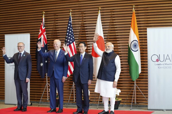 FILE- Leaders of Quadrilateral Security Dialogue (Quad) from left to right, Australian Prime Minister Anthony Albanese, U.S. President Joe Biden, Japanese Prime Minister Fumio Kishida, and Indian Prime Minister Narendra Modi, pose for photo at the entrance hall of the Prime Minister's Office of Japan in Tokyo, Japan, May 24, 2022. The Indo-Pacific strategic alliance known as the Quad, has repeatedly accused China of flexing its military muscles in the South China Sea and of pushing its maritime territorial claims. The navies of the four countries regularly hold drills seen as part of an initiative to counter China's growing assertiveness in the Pacific.(Zhang Xiaoyu/Pool Photo via AP, File)
