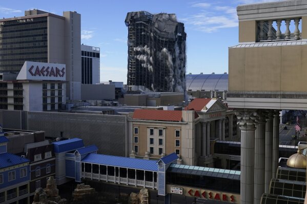 The former Trump Plaza casino is imploded on Wednesday, Feb. 17, 2021, in Atlantic City, N.J. After falling into disrepair, the one-time jewel of former President Donald Trump's casino empire is reduced to rubble, clearing the way for a prime development opportunity on the middle of the Boardwalk, where the Plaza used to market itself as "the center of it all." (AP Photo/Seth Wenig)