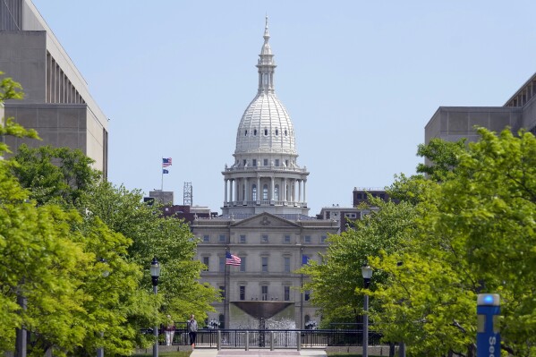 FILE - The Michigan Capitol is seen, May 24, 2023, in Lansing, Mich. Special election primaries are set to take place Tuesday, Jan. 30, 2024, in two Michigan House districts following the departure of their Democratic representatives, which has left the legislative chamber in an even split since November. (AP Photo/Carlos Osorio, File)