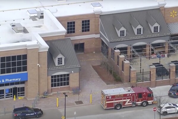 This photo made from video shows the scene where a vehicle crashed into a Walmart store in Canton Township, Mich., on Friday, March 1, 2024 (WXYZ via AP)