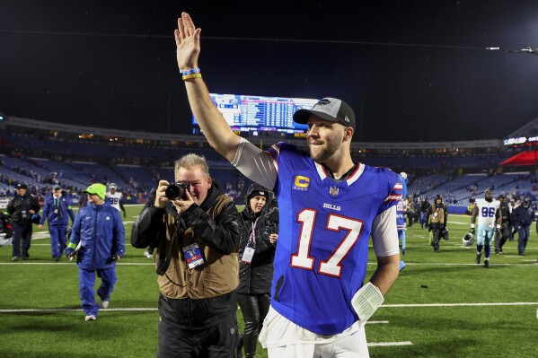 Buffalo Bills quarterback Josh Allen (17) waves to fans as he walks off the field after playing against the Dallas Cowboys in an NFL football game, Sunday, Dec. 17, 2023, in Orchard Park, N.Y. (AP Photo/Jeffrey T. Barnes)