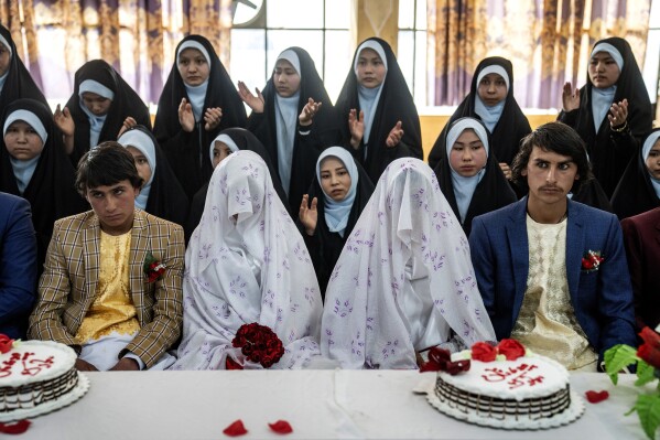Afghan brides and grooms participate in a mass wedding ceremony in Kabul, Afghanistan, on International Women's Day, March 8, 2023. (AP Photo/Ebrahim Noroozi)