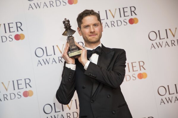 
              Actor Kyle Soller poses for photographers backstage with his Best Actor award for his role in the play 'The Inheritance at the Olivier Awards in London, Sunday, April 7, 2019. (Photo by Vianney Le Caer/Invision/AP)
            