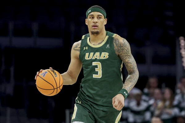 UAB forward Yaxel Lendeborg (3) brings the ball down court during the first half of an NCAA college basketball game against Memphis in the championship of the American Athletic Conference tournament, Sunday, March 16, 2025, in Fort Worth, Texas. (AP Photo/Gareth Patterson)