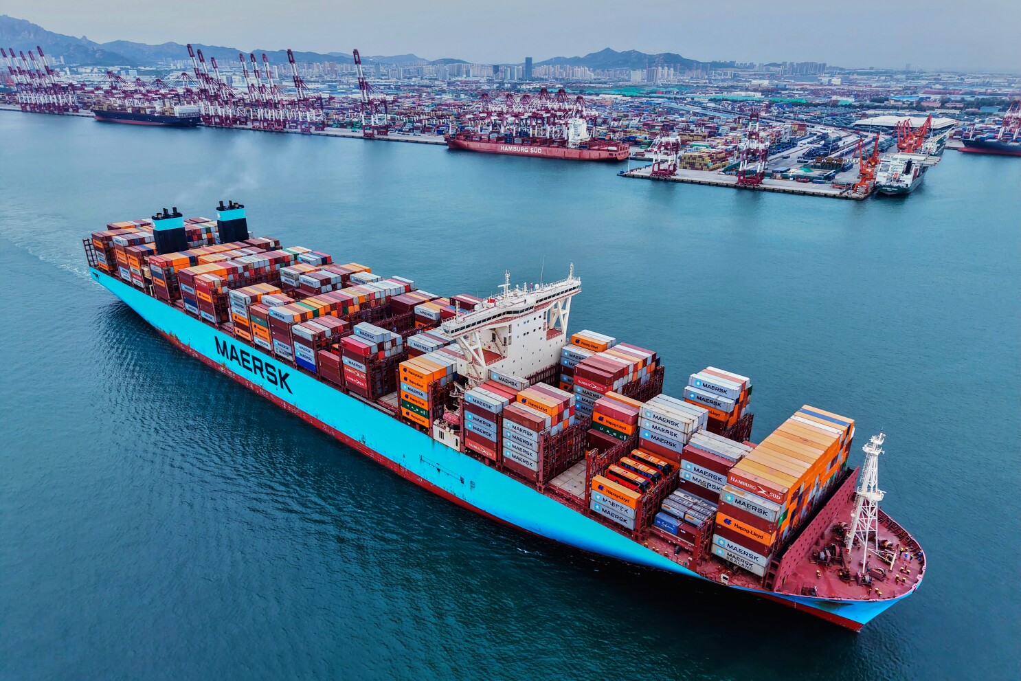 China's exports to US sink, offset by trade with other economies, as US tariffs hit global trade
