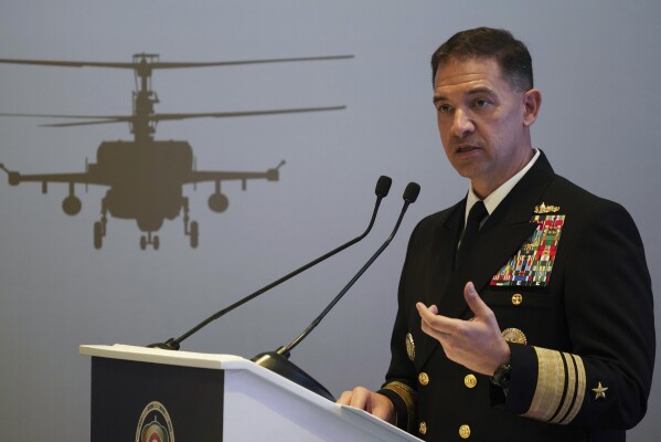FILE - U.S. Navy Vice Adm. Brad Cooper, who heads the Navy's Bahrain-based 5th Fleet, speaks at an event at the International Defense Exhibition and Conference in Abu Dhabi, United Arab Emirates, Feb. 21, 2023. Iran is "very directly involved" in attacks by Yemen's Houthi rebels on shipping over Israel's war on Hamas in the Gaza Strip, Cooper told The Associated Press on Monday, Jan. 22, 2024. (AP Photo/Jon Gambrell, File)