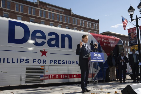 FILE - After signing a declaration of candidacy to run for president and walking out of the New Hampshire Statehouse, Democratic Rep. Dean Phillips addresses the crowd, Friday, Oct. 27, 2023, in Concord, Minn. (Glen Stubbe/Star Tribune via AP, File)