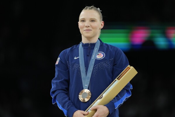 Jade Carey fights through illness to win a second medal in Paris, a bronze  on vault | AP News