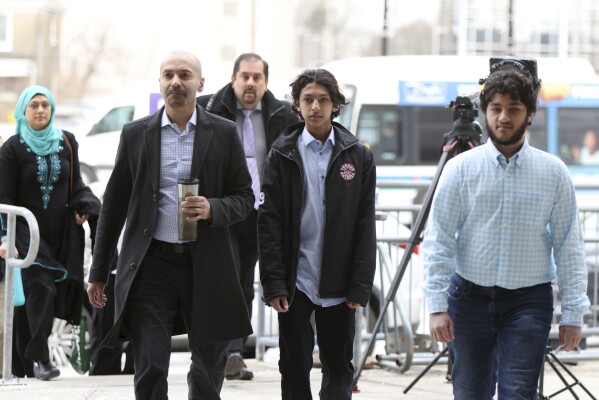 Supporters of the Afzaal family arrive at the London courthouse to attend the sentencing hearing of Nathaniel Veltman in London, Ont., Thursday, Feb. 22, 2024. Veltman, found guilty of using his pickup truck to kill four members of a Muslim family was sentenced to life in prison as a judge ruled that the actions of the “admitted white nationalist” amounted to terrorism.(Nicole Osborne /The Canadian Press via AP)