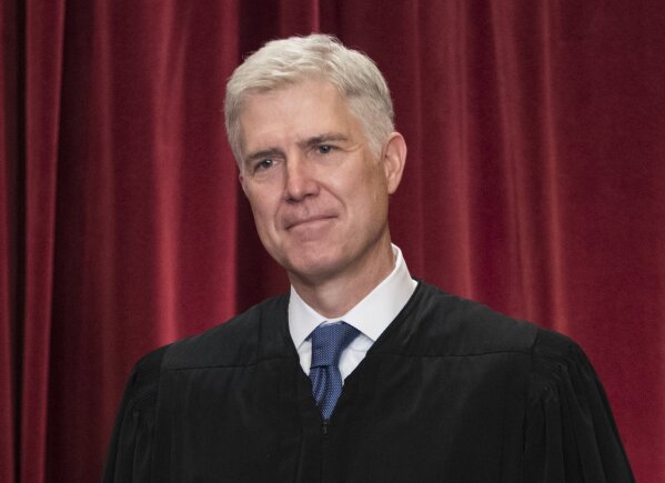 FILE - In this June 1, 2017, file photo Supreme Court Associate Justice Neil Gorsuch is seen during an official group portrait at the Supreme Court Building Washington. (AP Photo/J. Scott Applewhite, File)
            