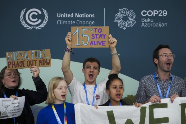 Activists participate in a demonstration for phasing out fossil fuels at the COP29 U.N. Climate Summit, Nov. 19, 2024, in Baku, Azerbaijan. (AP Photo/Sergei Grits, File)