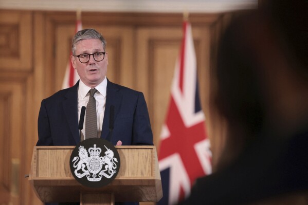 FILE - British Prime Minister Keir Starmer delivers a speech, following his first cabinet meeting as Prime Minister, in London, Saturday, July 6, 2024. Rwanda's government said late Monday, July 8, it is aware of the United Kingdom's intention to terminate its plan to deport asylum-seekers to the East African country. Starmer said in his first news conference Saturday that the Rwanda deportation plan “was dead and buried before it started.” (Claudia Greco, Pool Photo via ĢӰԺ, File)