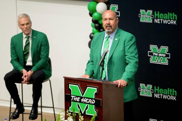 Marshall University athletic director Christian Spears speaks as he introduces head football coach Tony Gibson during press conference on Thursday, Dec. 12, 2024, at the Brad D. Smith Center for Business and Innovation in Huntington, W.Va. (Ryan Fischer/The Herald-Dispatch via AP, File)