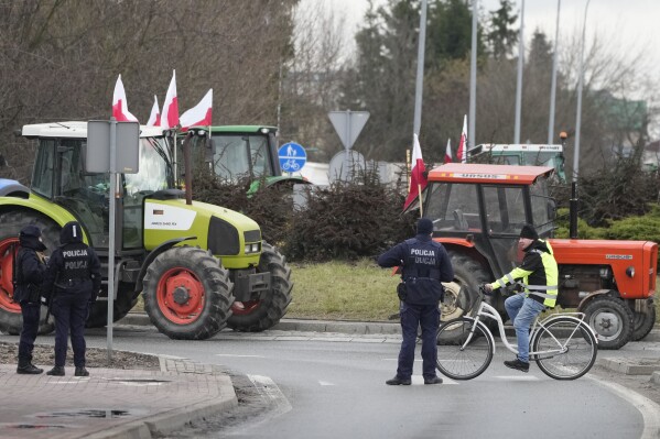 Polish farmers drive tractors in a convoy as they intensify a nationwide protest against the import of Ukrainian foods and European Union environmental policies, in Minsk Mazowiecki, Poland, on Tuesday Feb. 20, 2024. Farmers across Europe have been protesting recently, worried that EU plans to place limits on the use of chemicals and on greenhouse gas emissions will result in a reduction in production and income. They are also in revolt against competition from non-EU countries, in particular Ukraine. (APPhoto/Czarek Sokolowski)