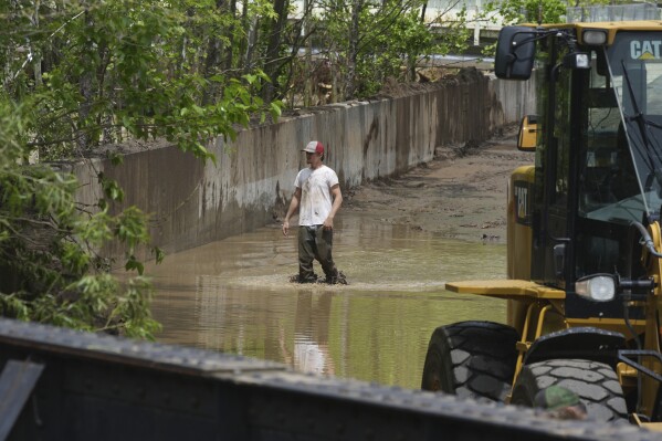 Clean up continues inside the fire station after flooding on Wednesday, May 14, 2025 in Westernport, Md. (AP Photo/Gene J. Puskar)
