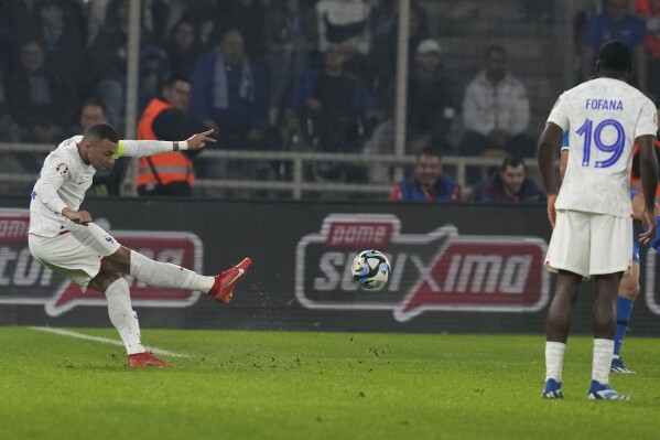 France's Kylian Mbappe kicks the ball during the Euro 2024 group B qualifying soccer match between Greece and France at OPAP Arena in Athens, Tuesday, Nov. 21, 2023. (AP Photo/Thanassis Stavrakis)