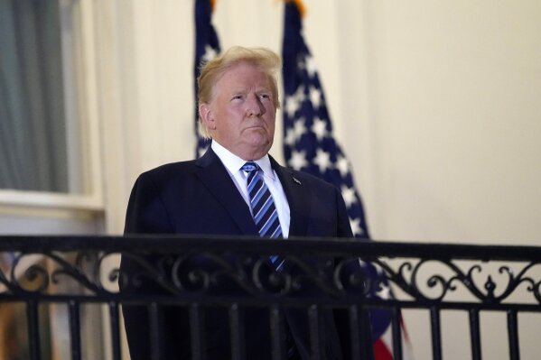 President Donald Trump stands on the balcony outside of the Blue Room as returns to the White House Monday, Oct. 5, 2020, in Washington, after leaving Walter Reed National Military Medical Center, in Bethesda, Md. A federal appeals court says Trump's accountant must turn over his tax records to a New York state prosecutor. The 2nd U.S. Circuit Court of Appeals in Manhattan ruled Wednesday, Oct. 7. (AP Photo/Alex Brandon)