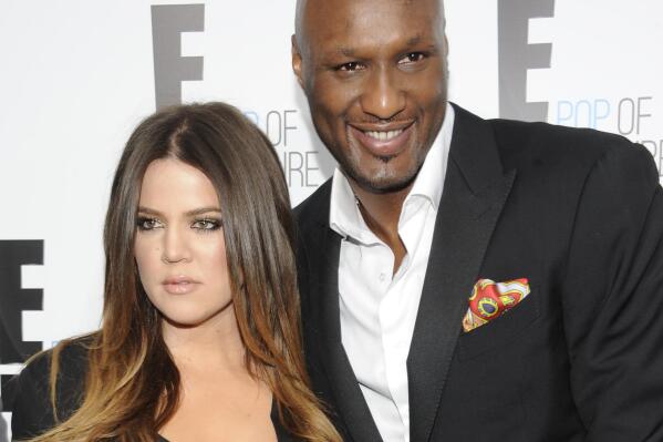 FILE - In this April 30, 2012, file photo, Khloe Kardashian Odom and Lamar Odom from the show "Keeping Up With The Kardashians" attend an E! Network upfront in New York. Kardashian filed for divorce from Odom for the second time on Thursday, May 26, 2016, citing irreconcilable differences. The pair married in September 2009 and broke up in late 2013, but Kardashian withdrew her first divorce petition after Odom was found unconscious at a Nevada brothel last year and required serious medical treatment. (AP Photo/Evan Agostini, File)