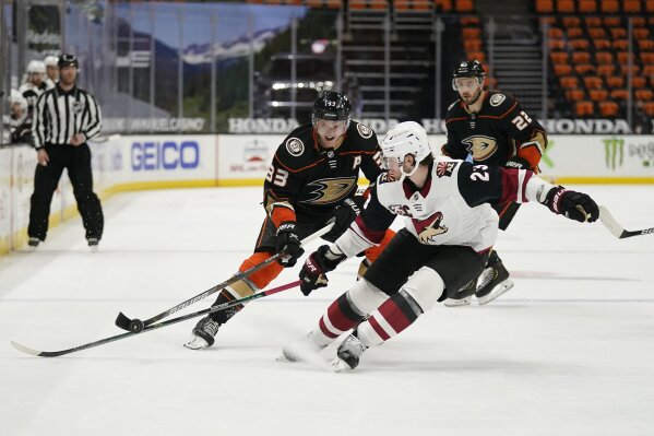 Anaheim Ducks' Jakob Silfverberg (33) is defended by Arizona Coyotes' Oliver Ekman-Larsson (23) during the second period of an NHL hockey game Friday, April 2, 2021, in Anaheim, Calif. (AP Photo/Jae C. Hong)