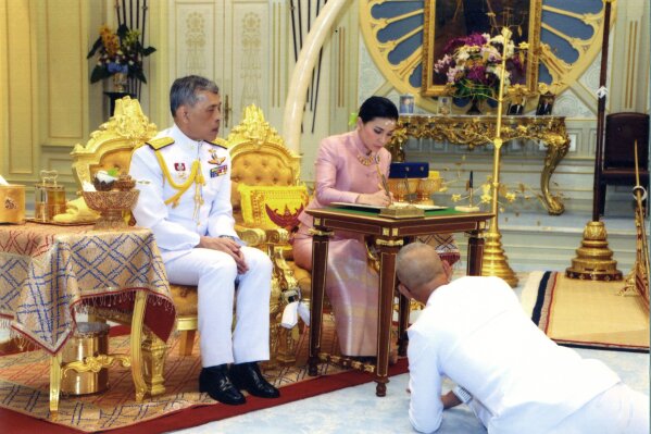 
              In this photo released by Bureau of the Royal Household ,Thailand's King Maha Vajiralongkorn Bodindradebayavarangkun, left, sits with Queen Suthida Vajiralongkorn Na Ayudhya as they sign their marriage certificates at Ampornsan Throne Hall in Bangkok, Thailand, Wednesday, May 1, 2019.Thailand's King Maha Vajiralongkorn, who will have his official coronation on Saturday, has appointed his consort as the country's queen. An announcement Wednesday in the Royal Gazette said Suthida Vajiralongkorn Na Ayudhya is legally married to the 66-year-old king, and is now Queen Suthida. (Bureau of the Royal Household via AP)
            