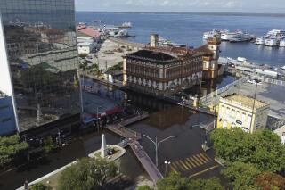 Aerial view of streets flooded by the Negro River, in downtown Manaus, Amazonas state, Brazil, Tuesday, June 1, 2021. Rivers around Brazil's biggest city in the Amazon rain forest have swelled to levels unseen in over a century of record-keeping, according to data published Tuesday by Manaus' port authorities. (AP Photos/Nelson Antoine)
