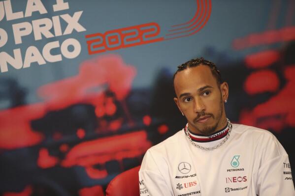 Mercedes driver Lewis Hamilton of Britain answers to reporters during a news conference ahead the free practice at the Monaco racetrack, in Monaco, Wednesday, May 27, 2022. The Formula one race will be held on Sunday. (AP Photo/Daniel Cole)