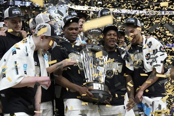 CORRECTS TO SUNDAY, MARCH 12, 2023, NOT SATURDAY, MARCH 11, 2023 - The Purdue Boilermakers celebrate the team's 67-65 win over Penn State for the Big Ten tournament championship in an NCAA college basketball game Sunday, March 12, 2023, in Chicago. (AP Photo/Nam Y. Huh)