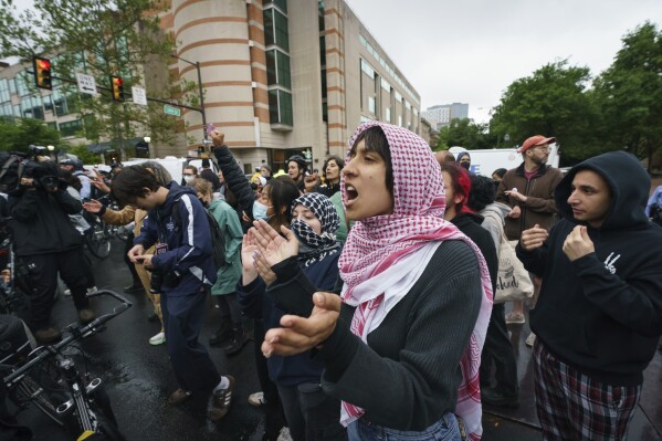 Protesters stand on the University of Pennsylvania campus, in Philadelphia, on Friday, May 10, 2024. (Jessica Griffin/The Philadelphia Inquirer via AP)