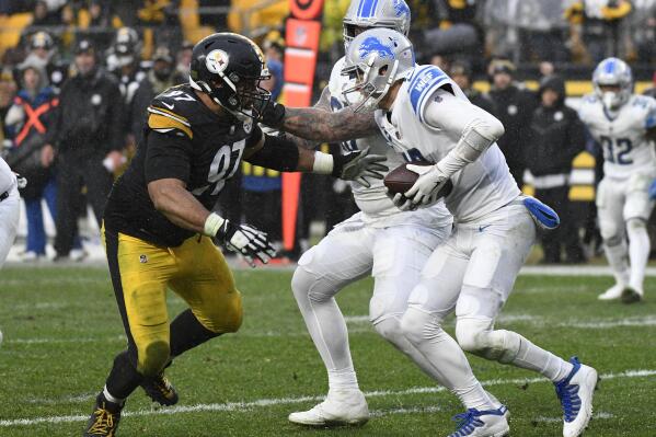 Pittsburgh Steelers defensive end Cameron Heyward (97) sacks Detroit Lions quarterback Jared Goff, front right, during the second half of an NFL football game in Pittsburgh, Sunday, Nov. 14, 2021. (AP Photo/Don Wright)
