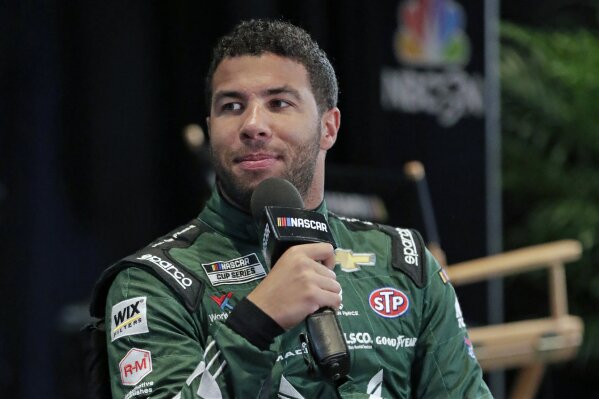 FILE - In this Feb. 12, 2020, file photo, Bubba Wallace takes part in an interview during NASCAR Daytona 500 auto racing media day at Daytona International Speedway in Daytona Beach, Fla. Corporate...