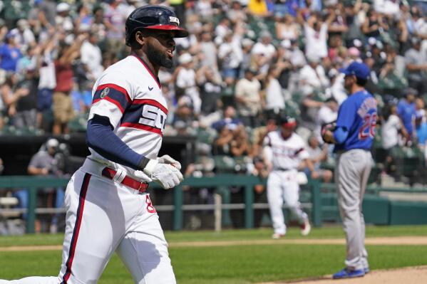 Chicago White Sox's Luis Robert rounds the bases after hitting a solo home run during the first inning of a baseball game against the Chicago Cubs in Chicago, Sunday, Aug. 29, 2021. (AP Photo/Nam Y. Huh)