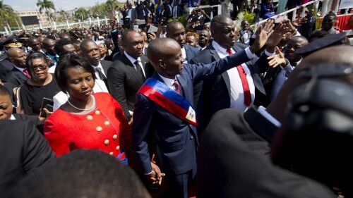 FILE - Haiti's President Jovenel Moise walks with his wife Martine to the National Palace after being sworn-in, in Port-au-Prince, Haiti Feb. 7, 2017. Attorneys for the widow of the slain president filed a lawsuit on June 22, 2023 in Florida against those accused in his assassination, which is still under investigation. (AP Photo/Dieu Nalio Chery, File)