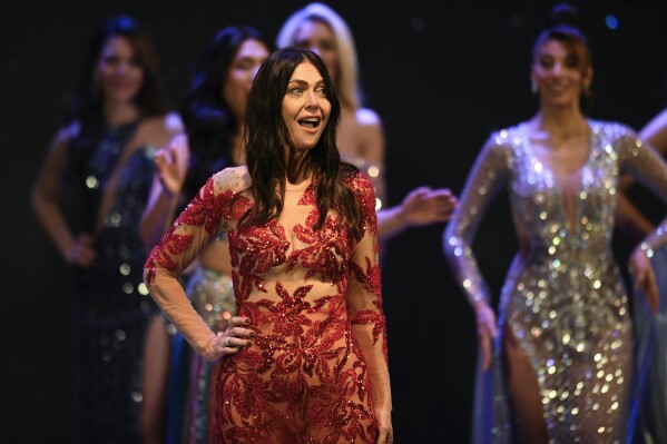 Contestant Alejandra Rodriguez competes in the Argentina Miss Universe pageant, in Buenos Aires, Argentina, Saturday, May 25, 2024. The 60-year-old lawyer is hoping to make history by becoming the oldest Miss Universe contestant. (AP Photo/Gustavo Garello)