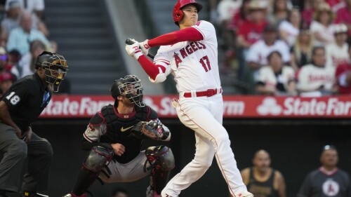 Los Angeles Angels designated hitter Shohei Ohtani (17) singles during the third inning of a baseball game against the Arizona Diamondbacks in Anaheim, Calif., Friday, June 30, 2023. (AP Photo/Ashley Landis)